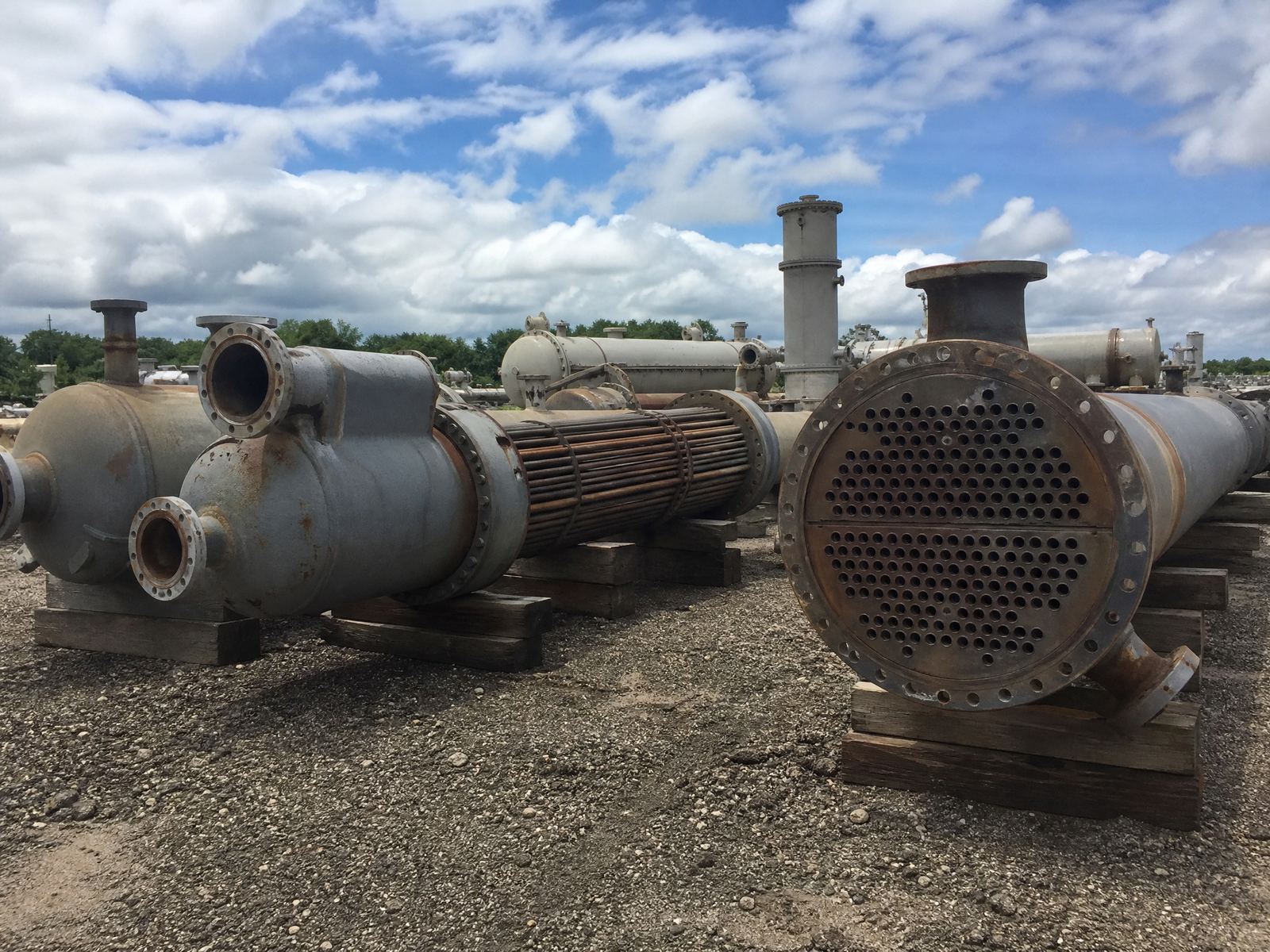 Shell and tube heat exchangers staged in an equipment yard
